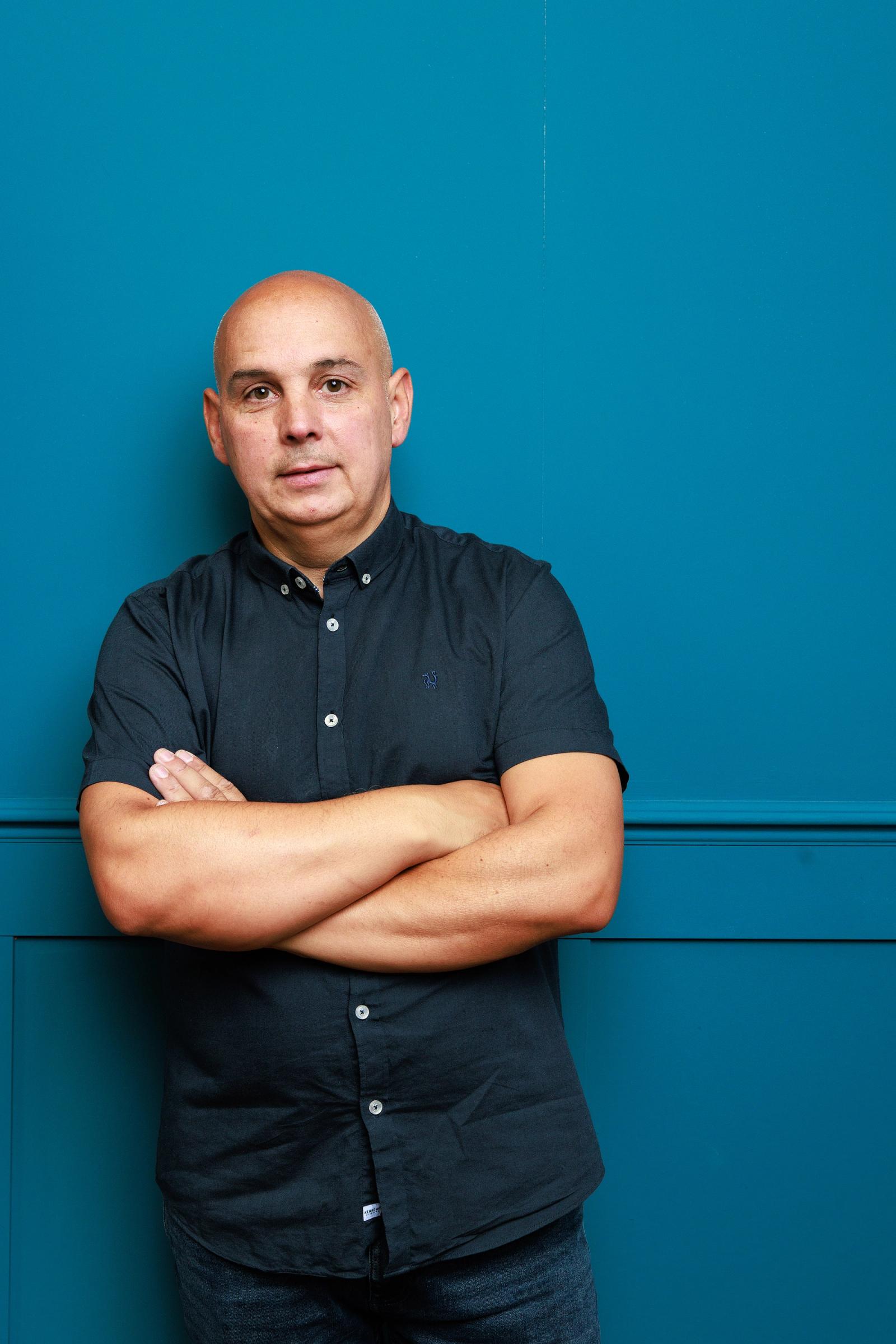 man standing with arms crossed