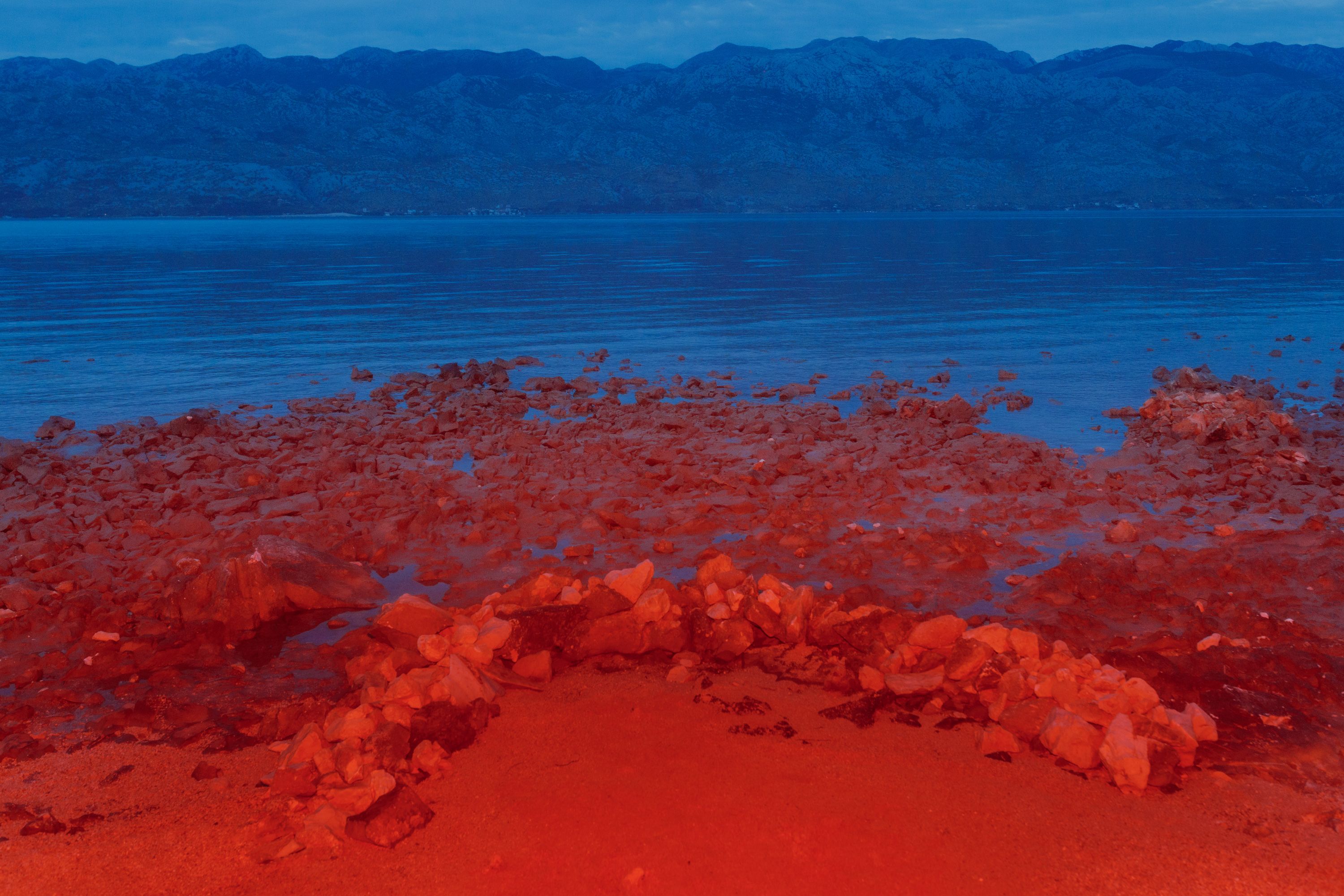 red stone circle blue sea velebit