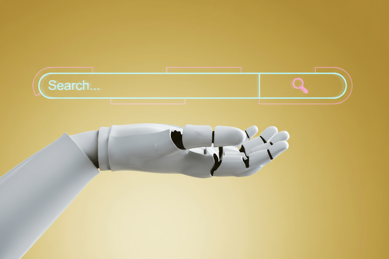 Ręka robota wskazująca na okno wyszukiwarki