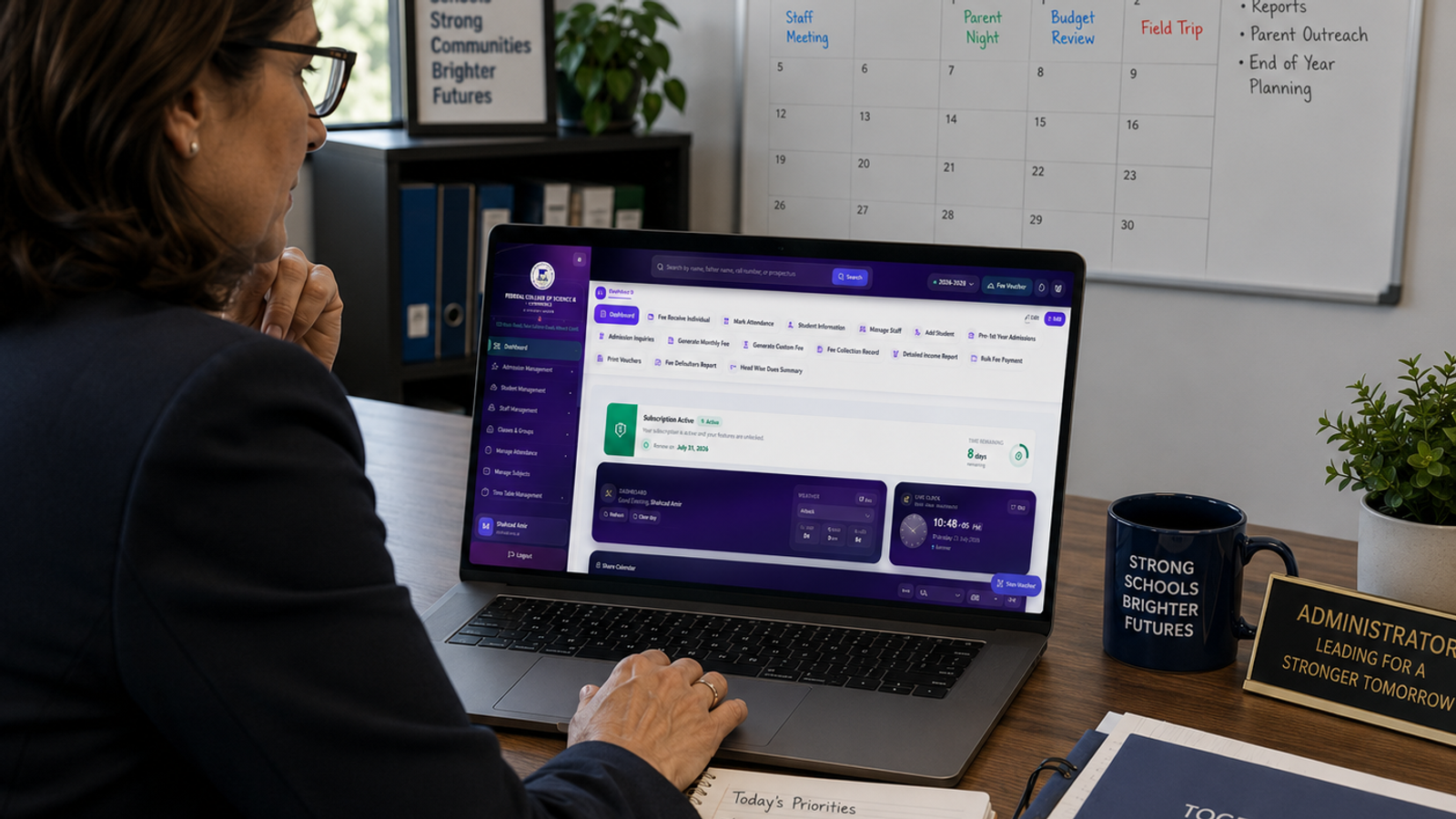 Administrator reviewing school management software dashboard on a laptop