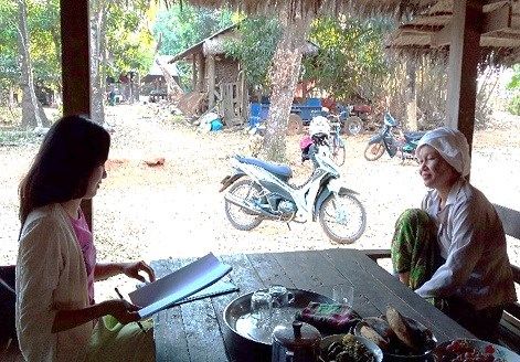 two women speaking, located in rural area