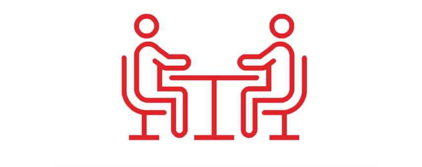 two people sitting at table icon