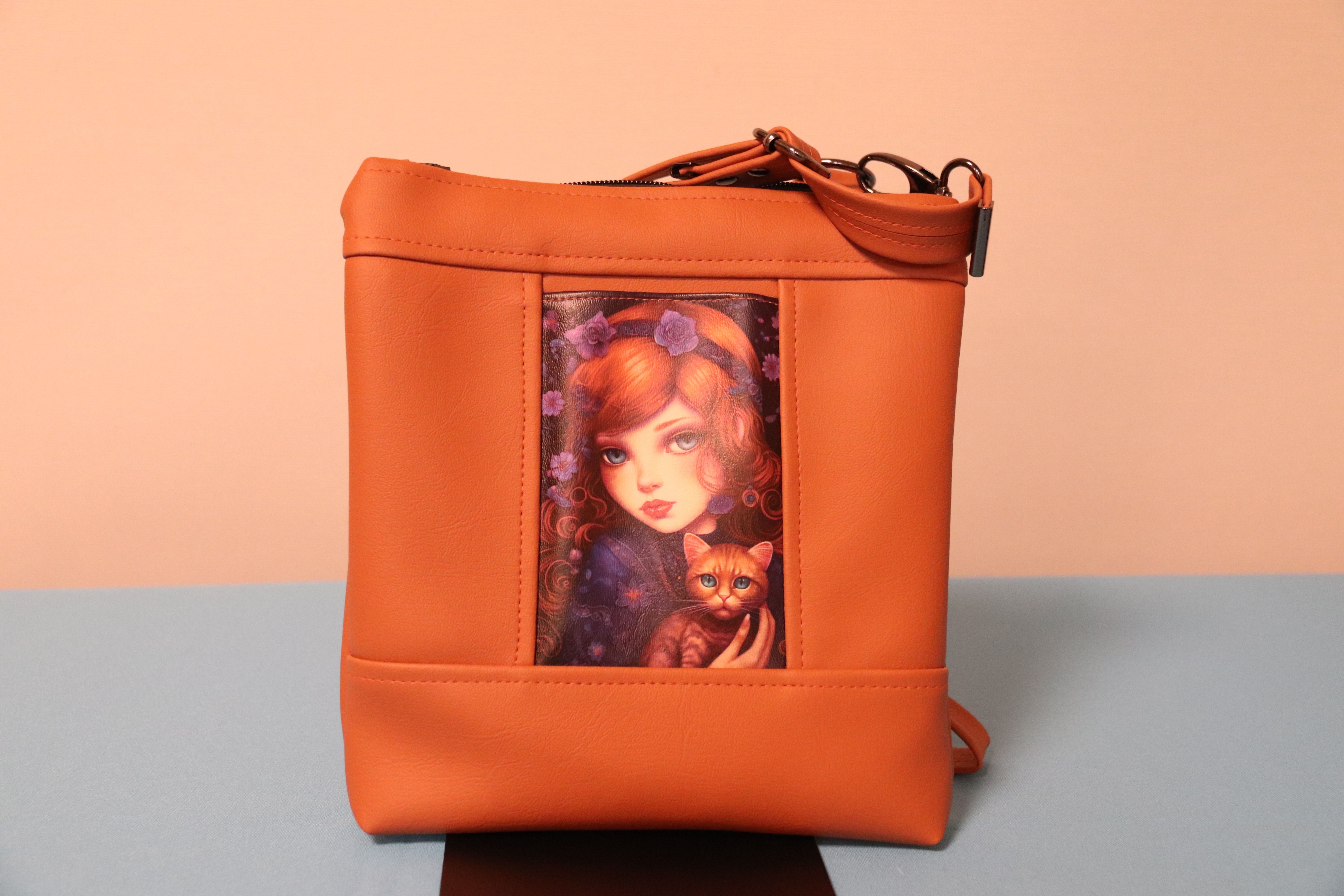 Brown shoulder bag with girl and cat print