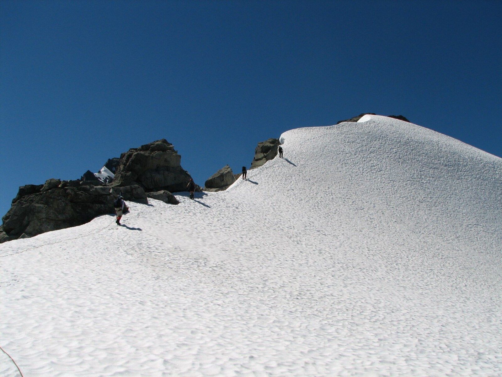 A climber on a snow ridge