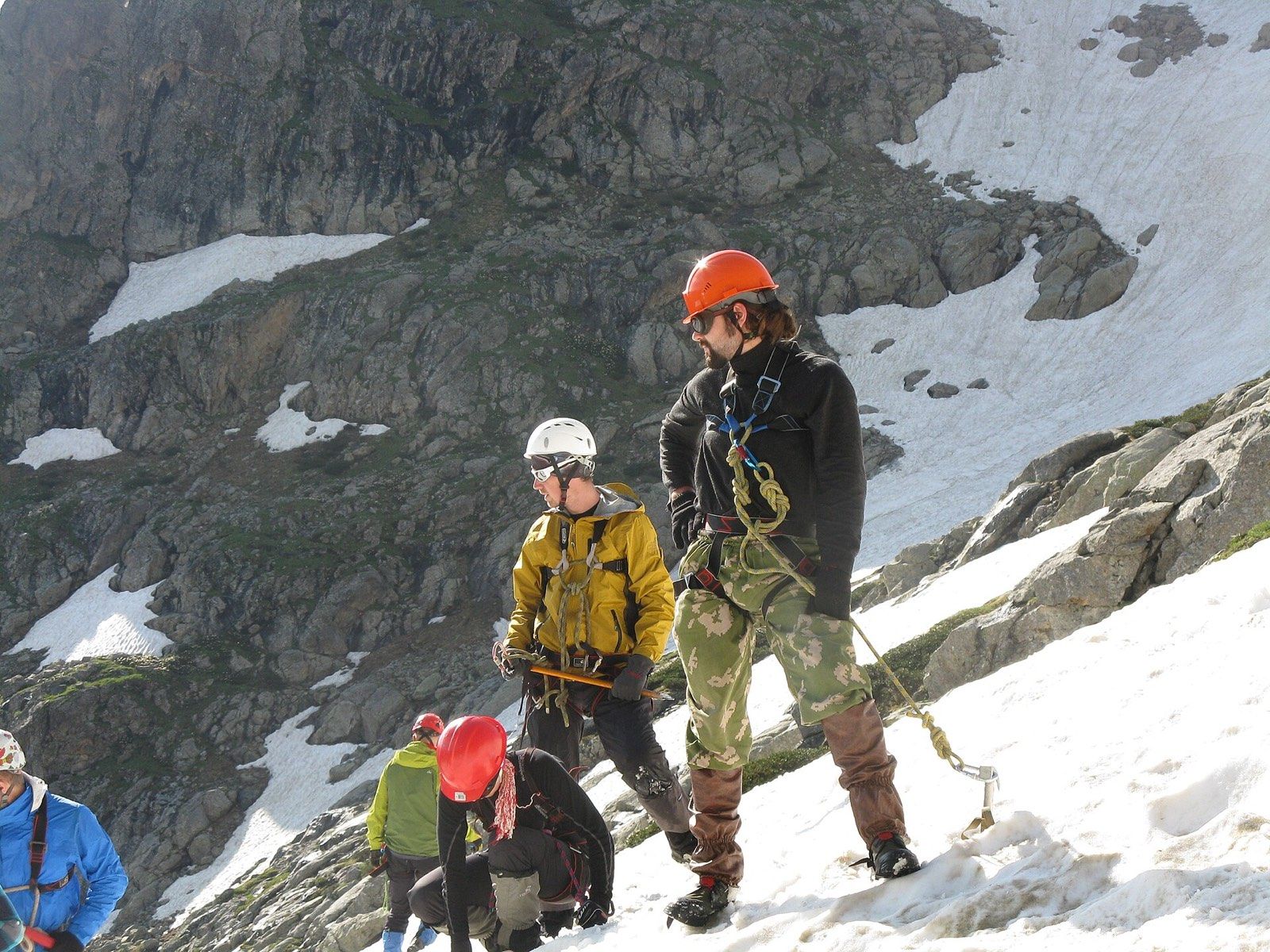 Climber training on a snowy mountain slope
