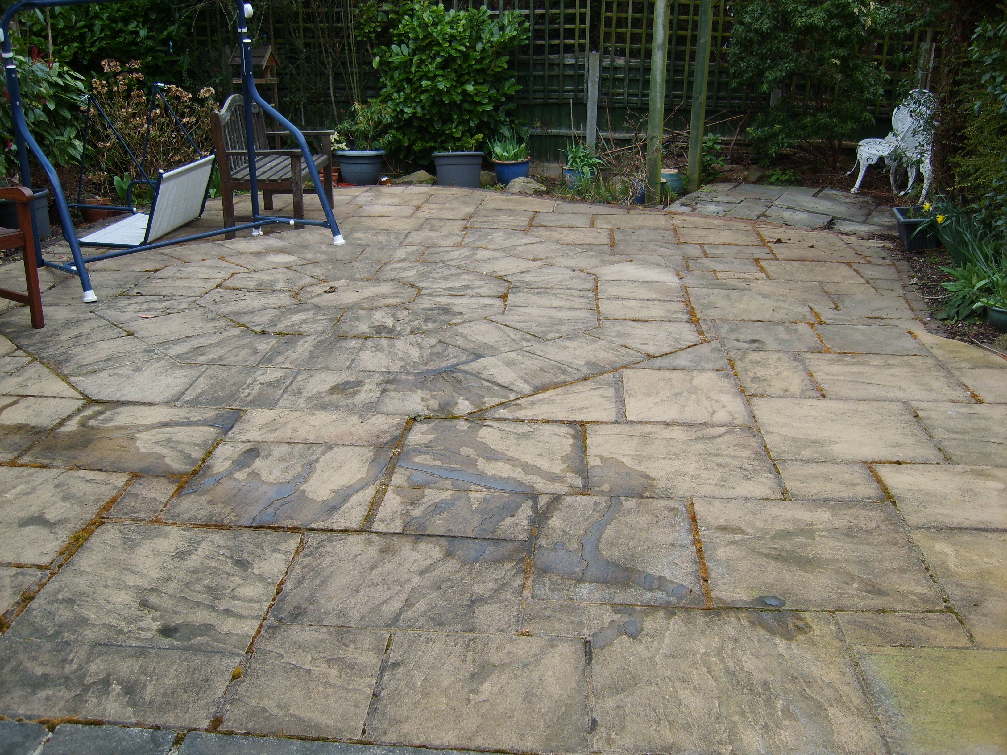 Large flagged patio, before