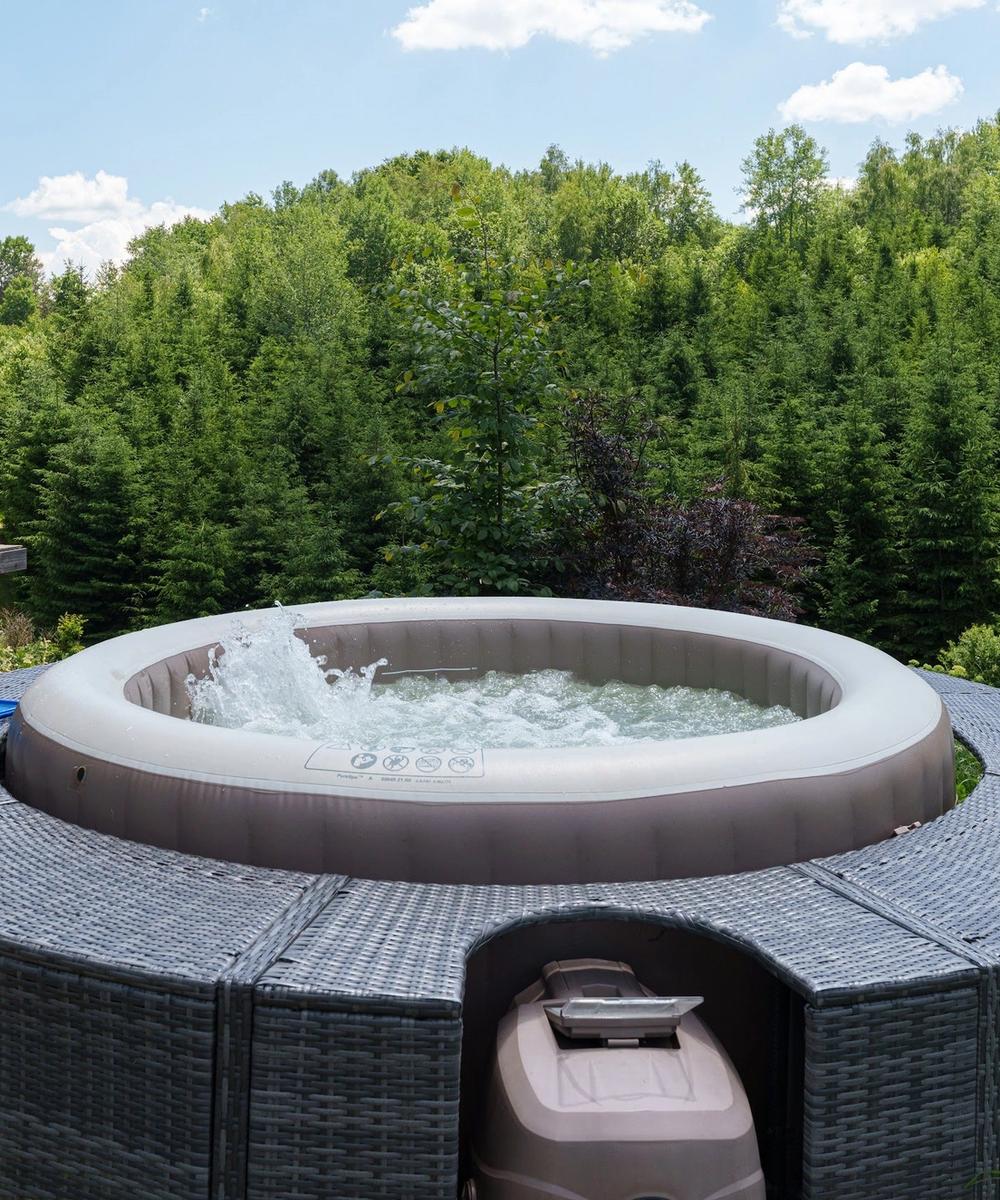 Hot tub with forest view Private hot tub on the deck of the Dyno tiny house, overlooking the pine forest