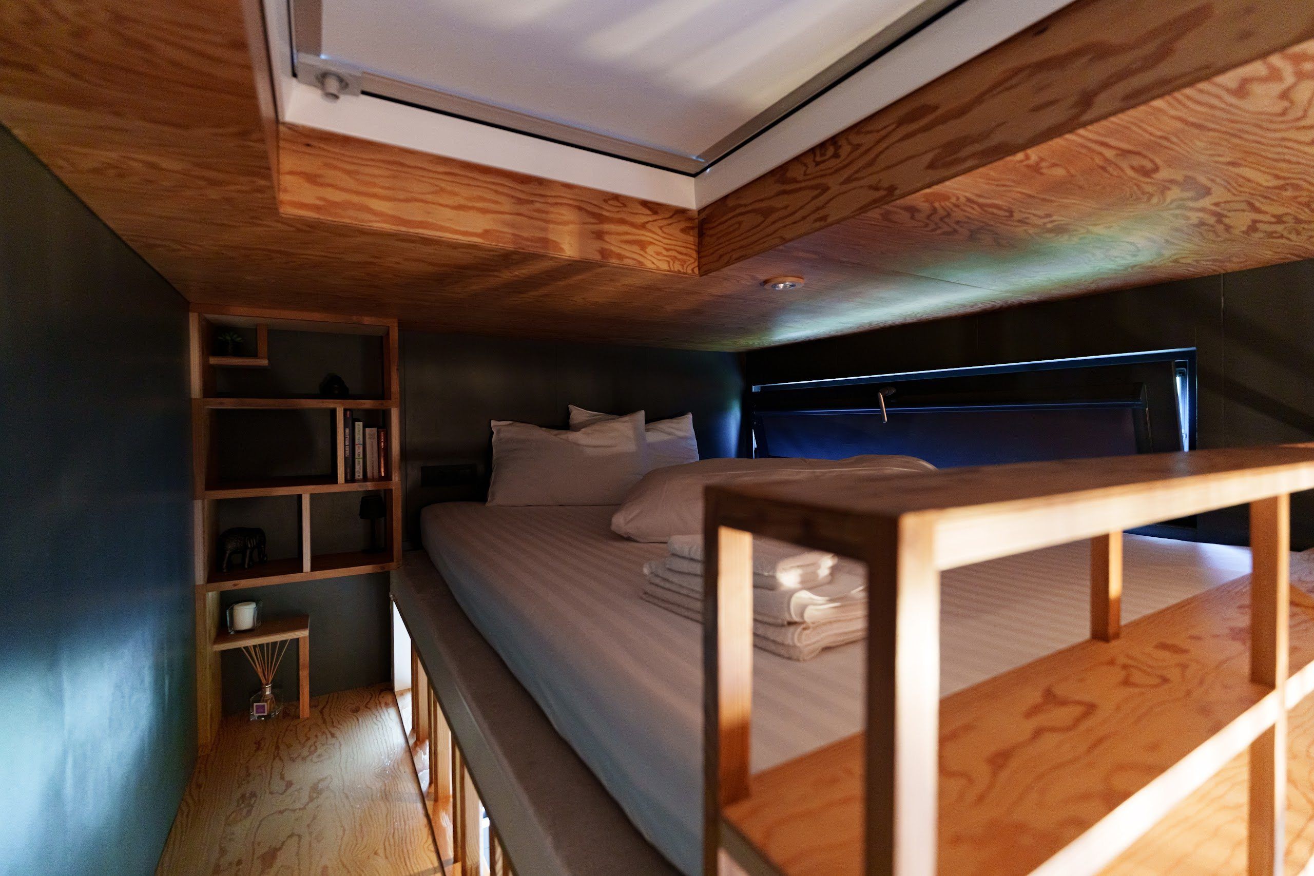 Bedroom with skylight for stargazing at Cappuccino cabin
