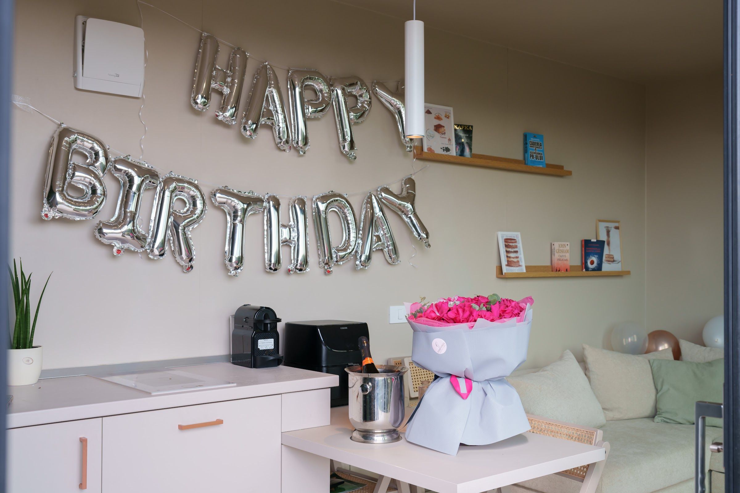 Birthday setup with Happy Birthday balloons, rose bouquet and prosecco in a Coniferis tiny house