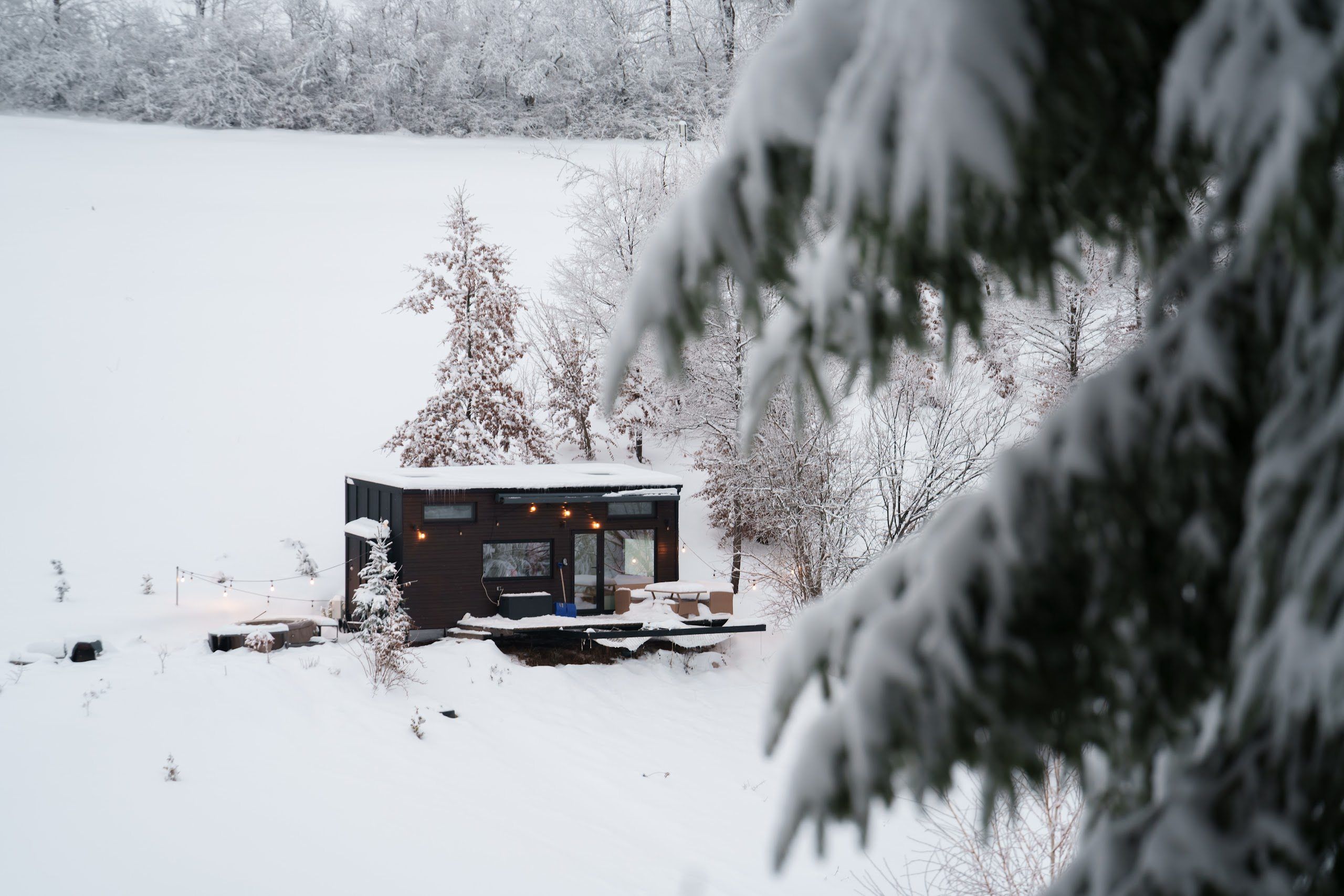Aerial winter view of Dyno cabin in the snowy Bihor landscape