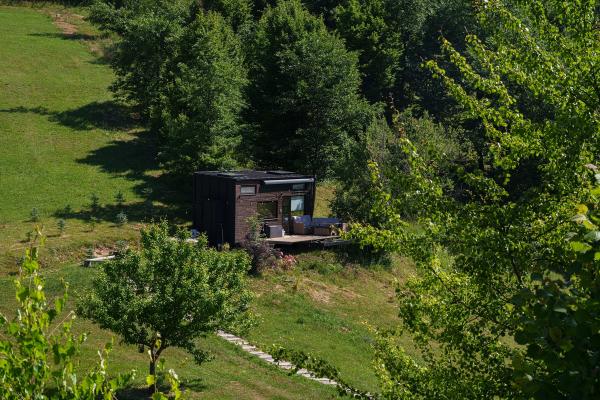 Aerial summer view of Dyno Tiny House and the forest in the Apuseni Mountains