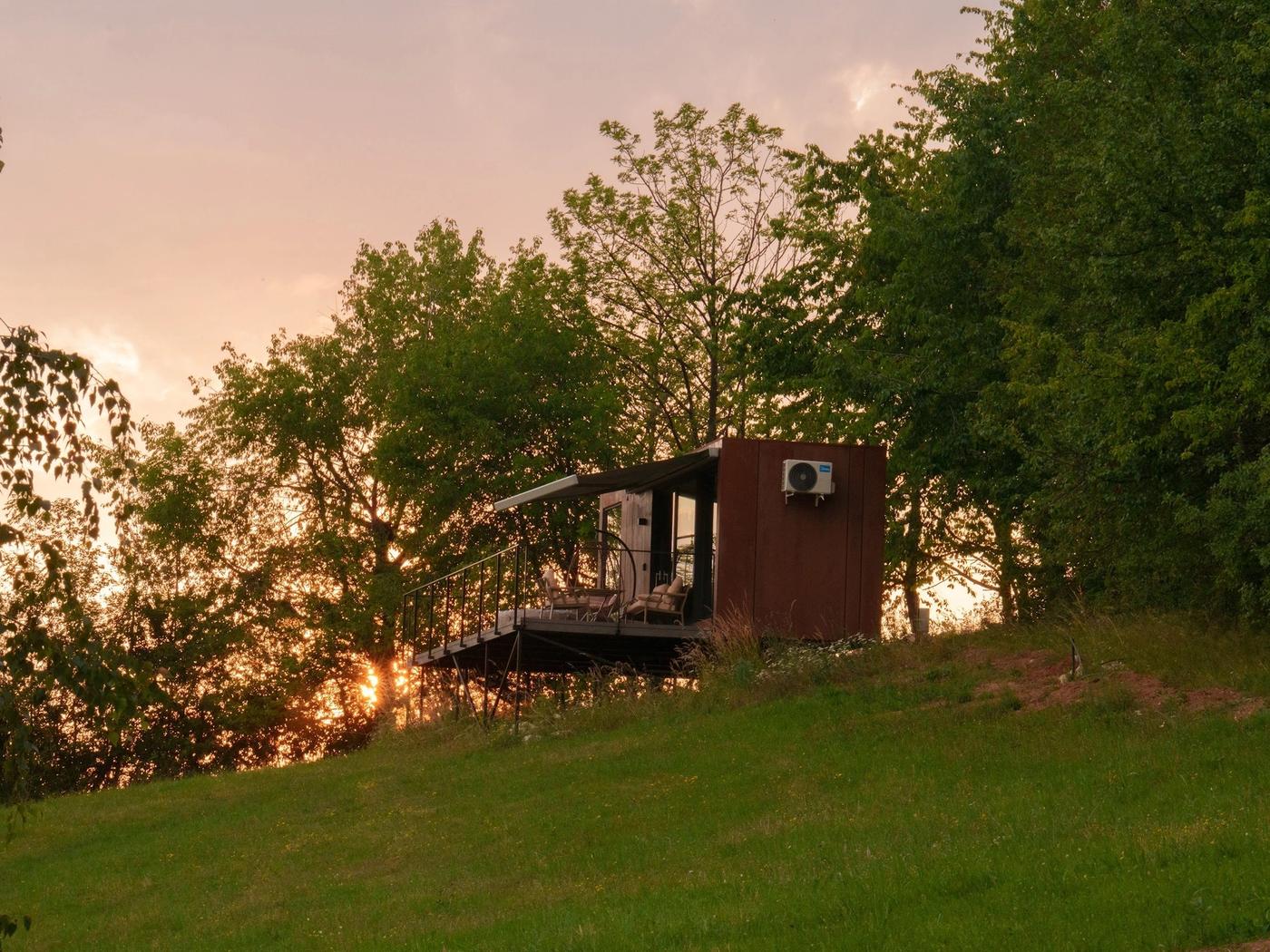 Tiramisu Tiny House at sunset Tiramisu tiny house at sunset on the hillside in the Apuseni Mountains