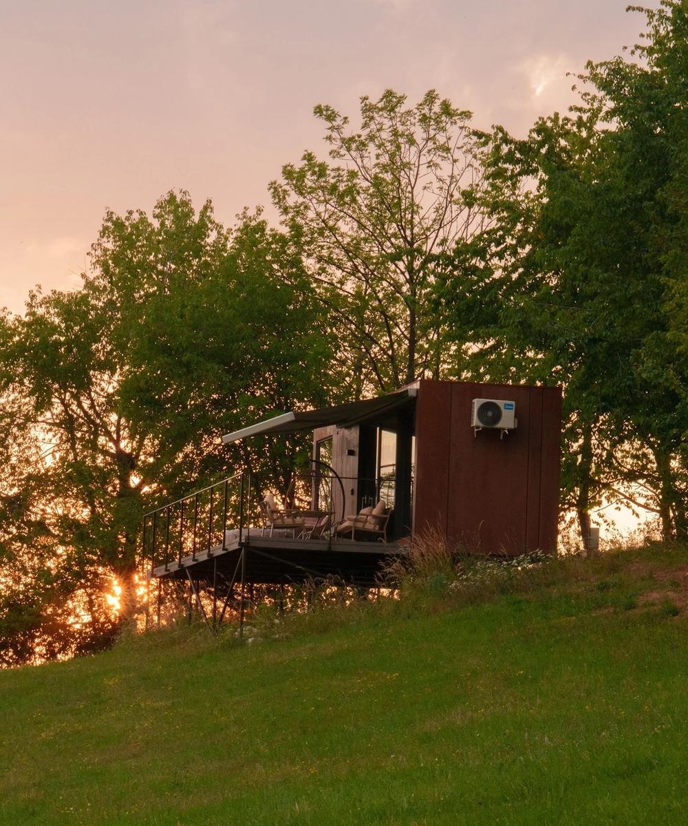 The Tiramisu tiny house at sunset The Tiramisu tiny house at sunset in the Apuseni Mountains, Coniferis Retreat