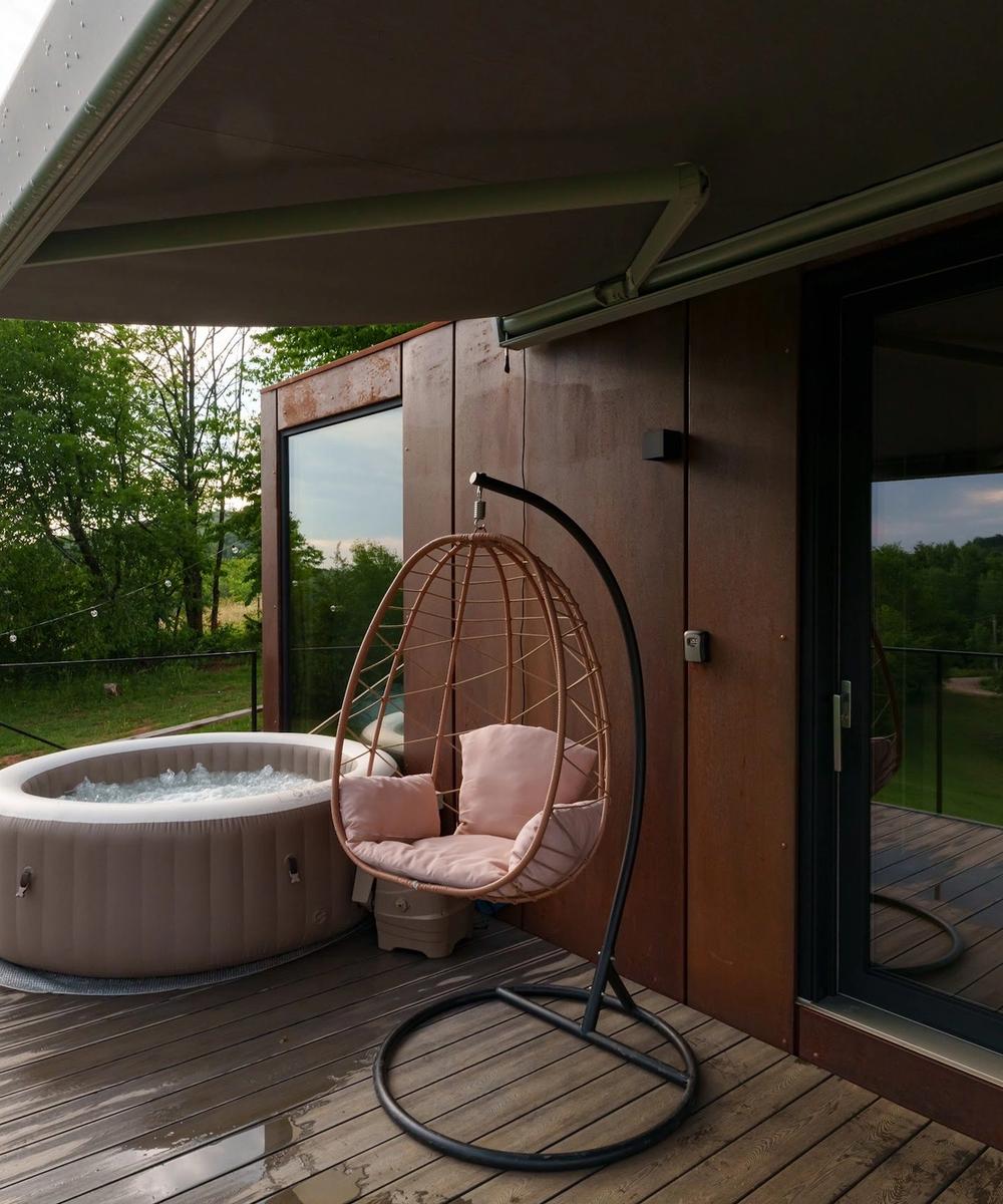 Hot tub and hanging chair Outdoor hot tub and hanging chair on the deck of the Tiramisu tiny house