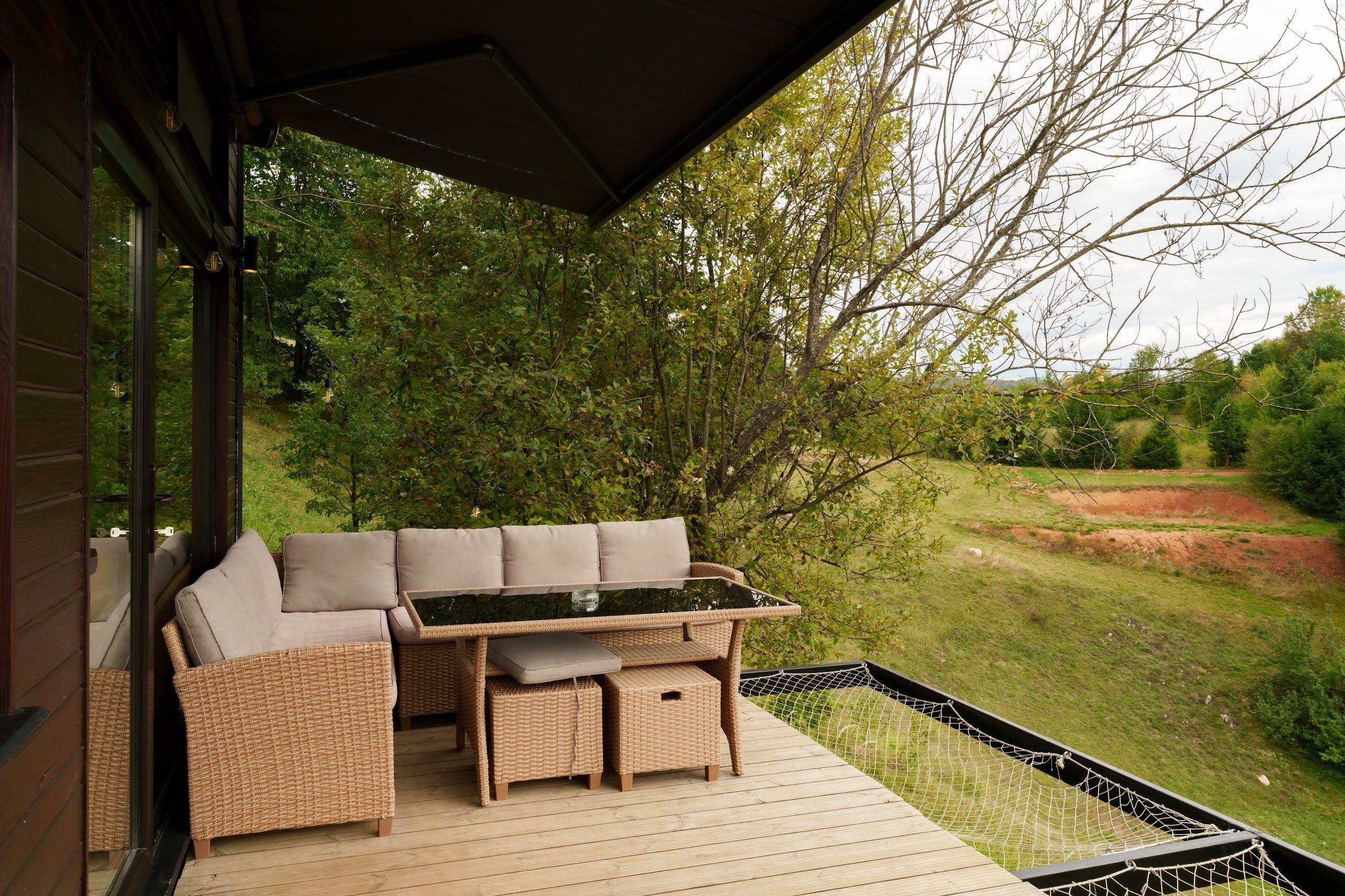 Furnished deck overlooking the valley at the Dyno tiny house