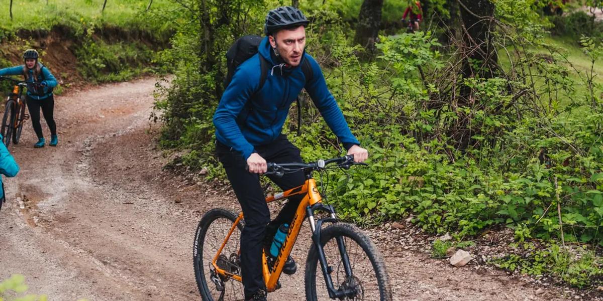 The trails can be ridden solo, if your navigation is good A lone cyclist on a mountain bike trail in the Pădurea Craiului Mountains