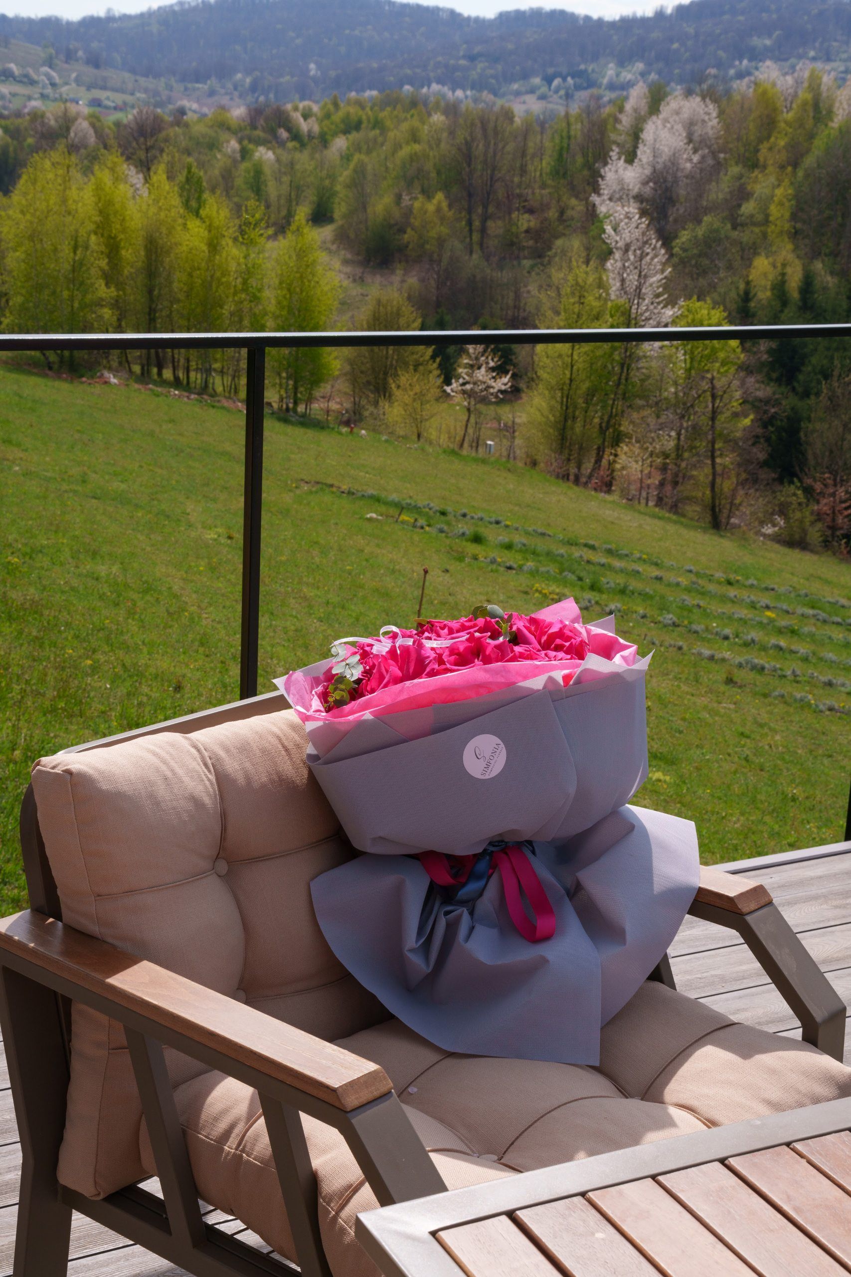 Bouquet of flowers on the terrace of a tiny house at Coniferis Retreat