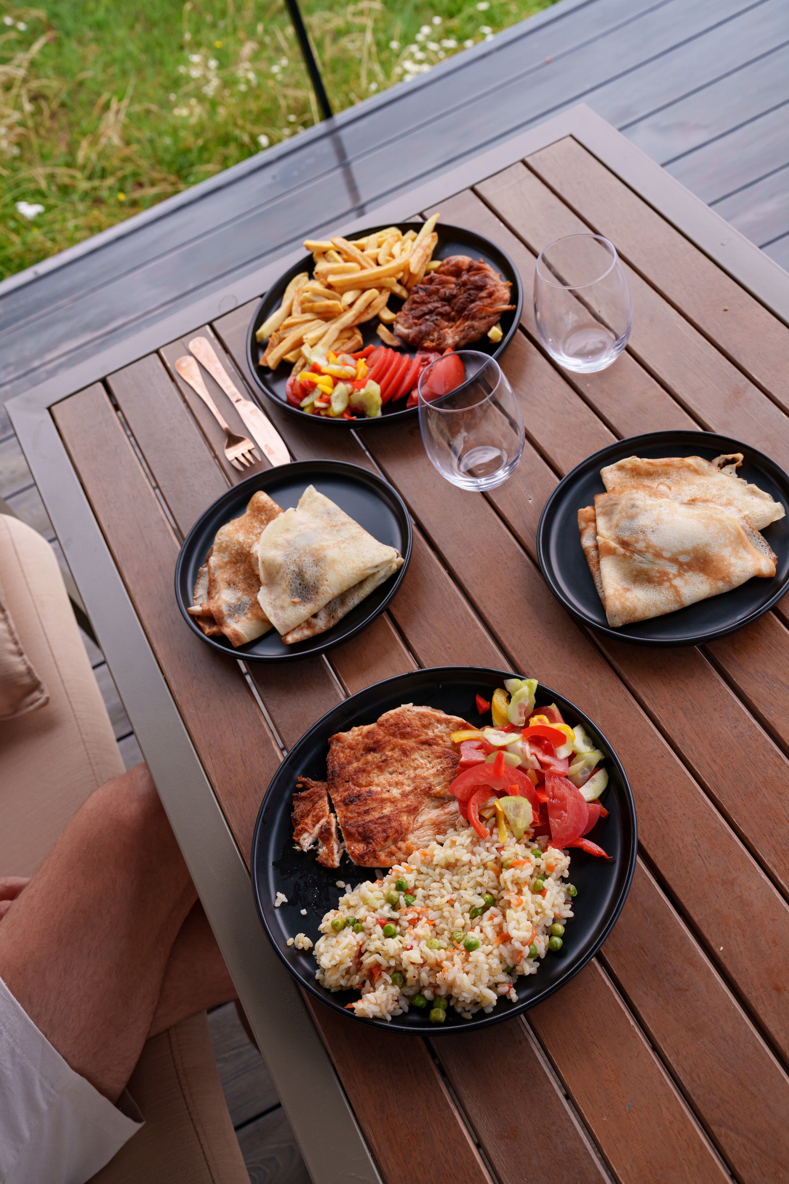Home-cooked dishes served on the terrace table at Coniferis Retreat