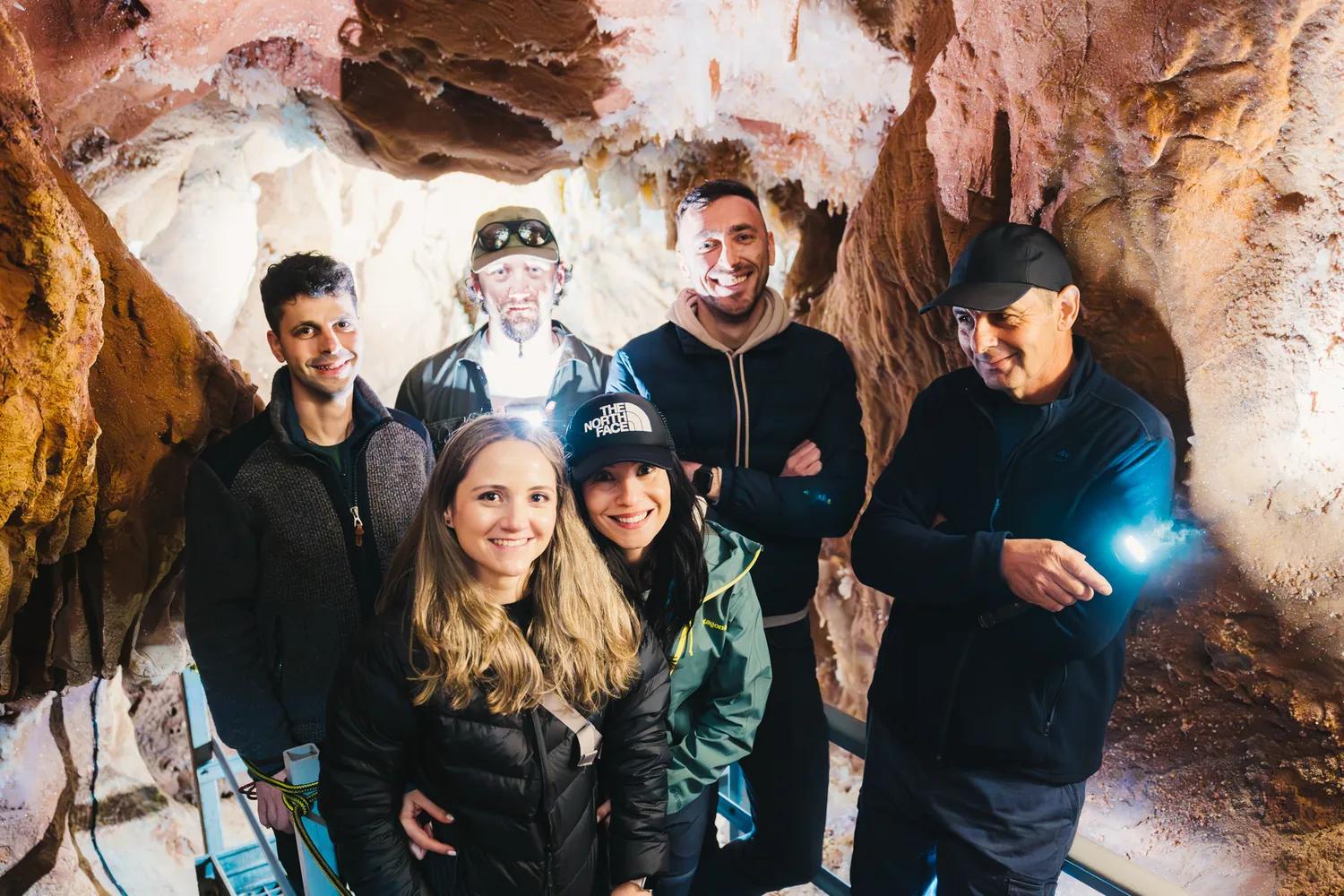 A guided group inside a cave in the Pădurea Craiului Mountains