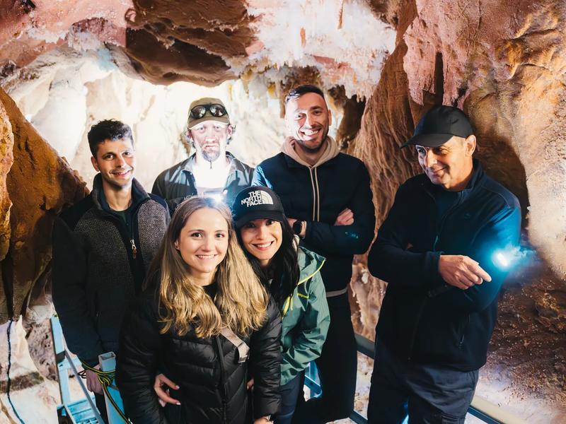 A guided group inside a cave in the Pădurea Craiului Mountains