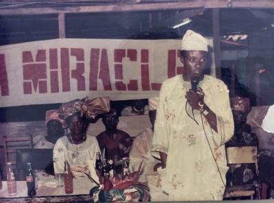 Rev Edward Adeniji Koye-Ladele with Pastor Mrs. Taiwo Koye-Ladele looking on from the background