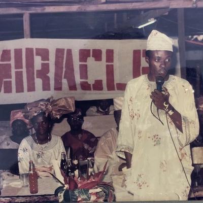 Rev Edward Adeniji Koye-Ladele with Pastor Mrs. Taiwo Koye-Ladele looking on from the background