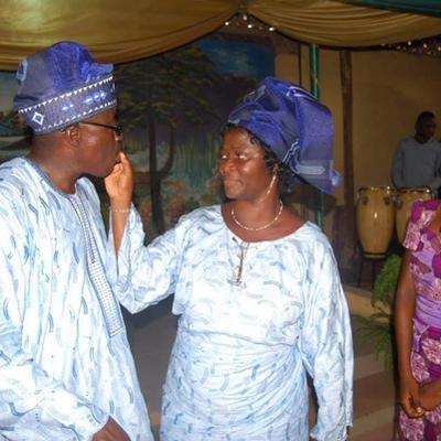 Tasting his birthday cake with Pastor Mrs. Koye-Ladele while Similoluwa looks on