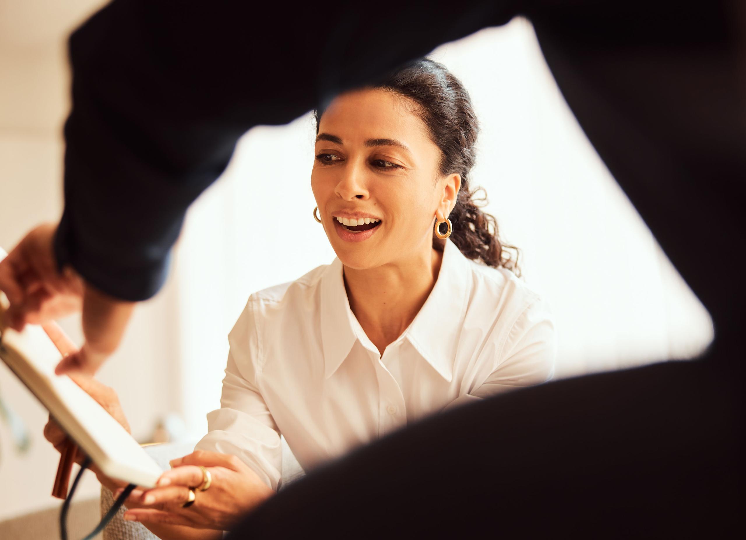 A man speaking to a woman