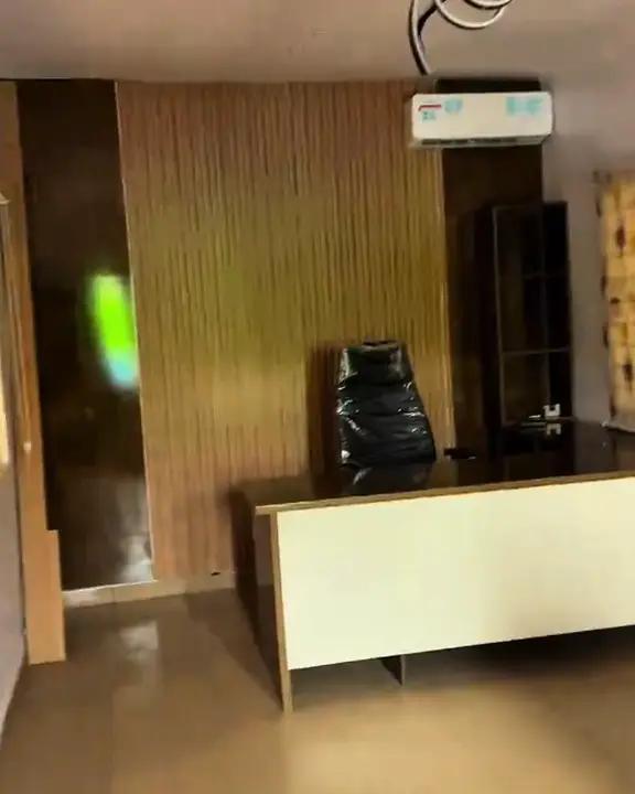 The renovated Jaylead office with a desk and wood panelling