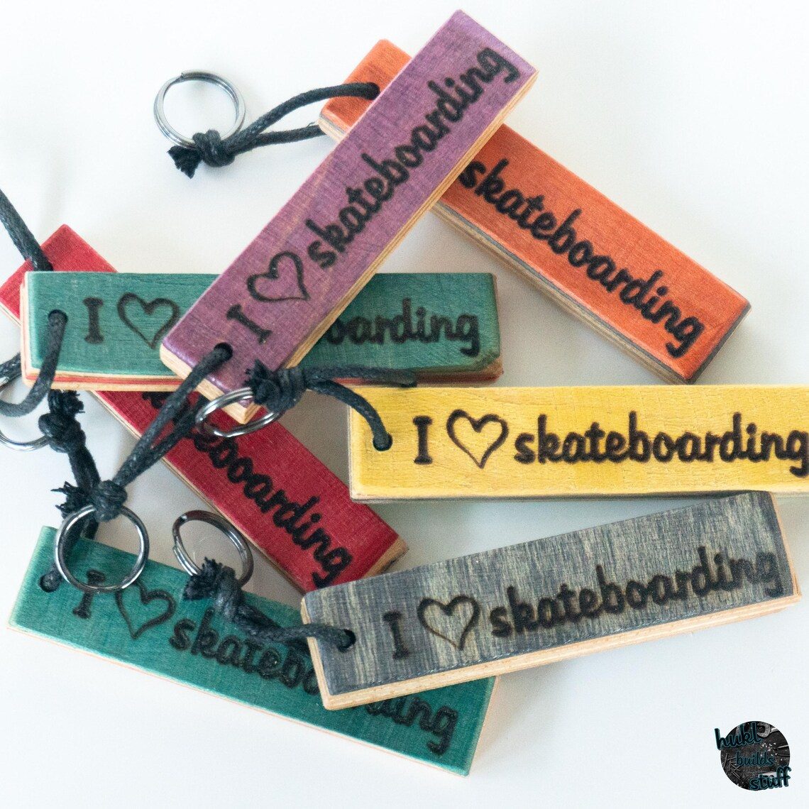 Keychains made from recycled skateboard decks with waxed cotton cord and a metal ring. Personalise yours with a name or short text.