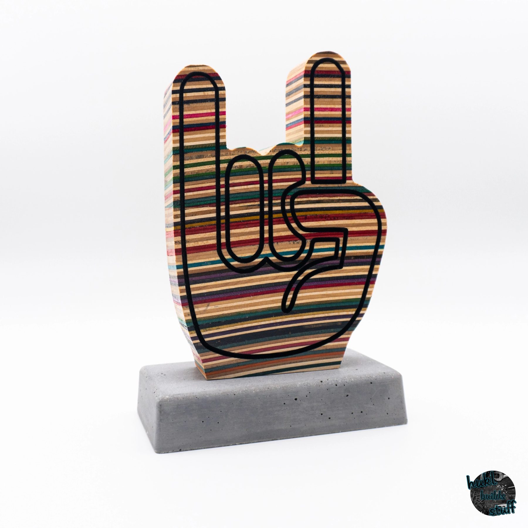 Rock On Hands made of used skateboards with concrete base