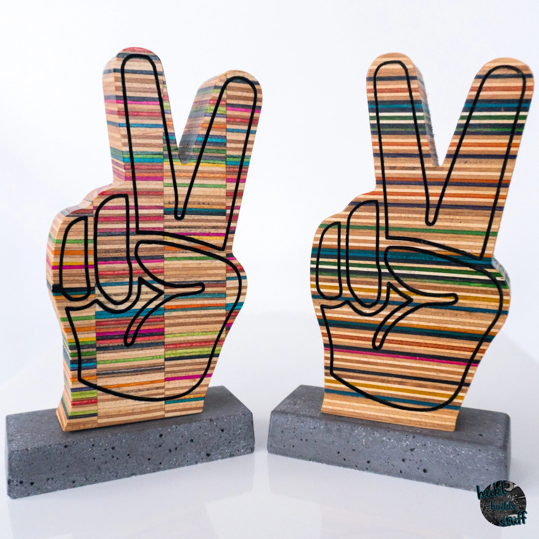 Peace Hands made of recycled skateboard descks with concrete base
