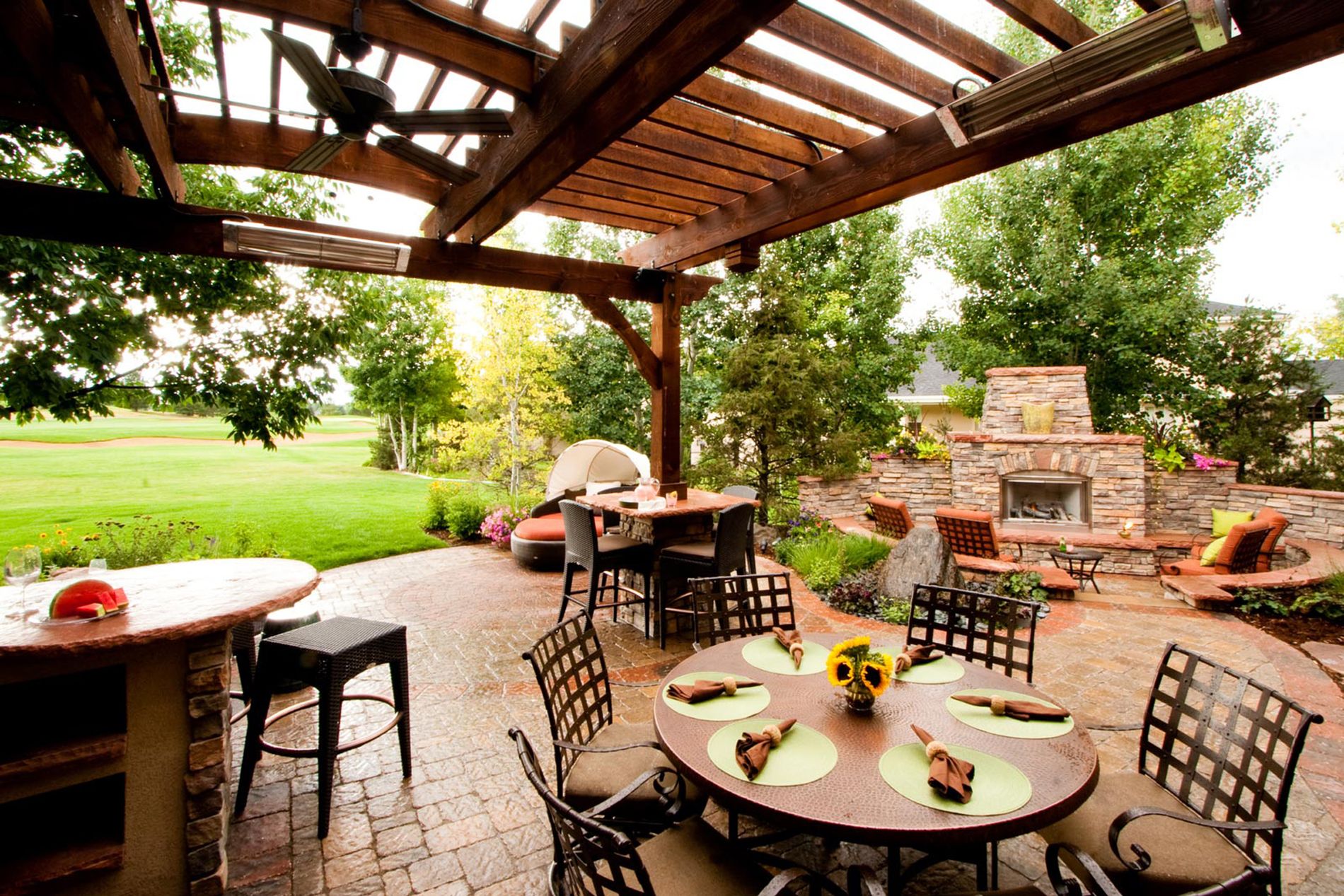 Outdoor Fireplace With Paver Patio and Shade Structure