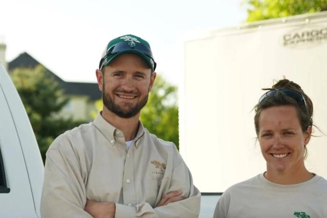 Lindgren Landscape staff standing outside smiling with arms crossed