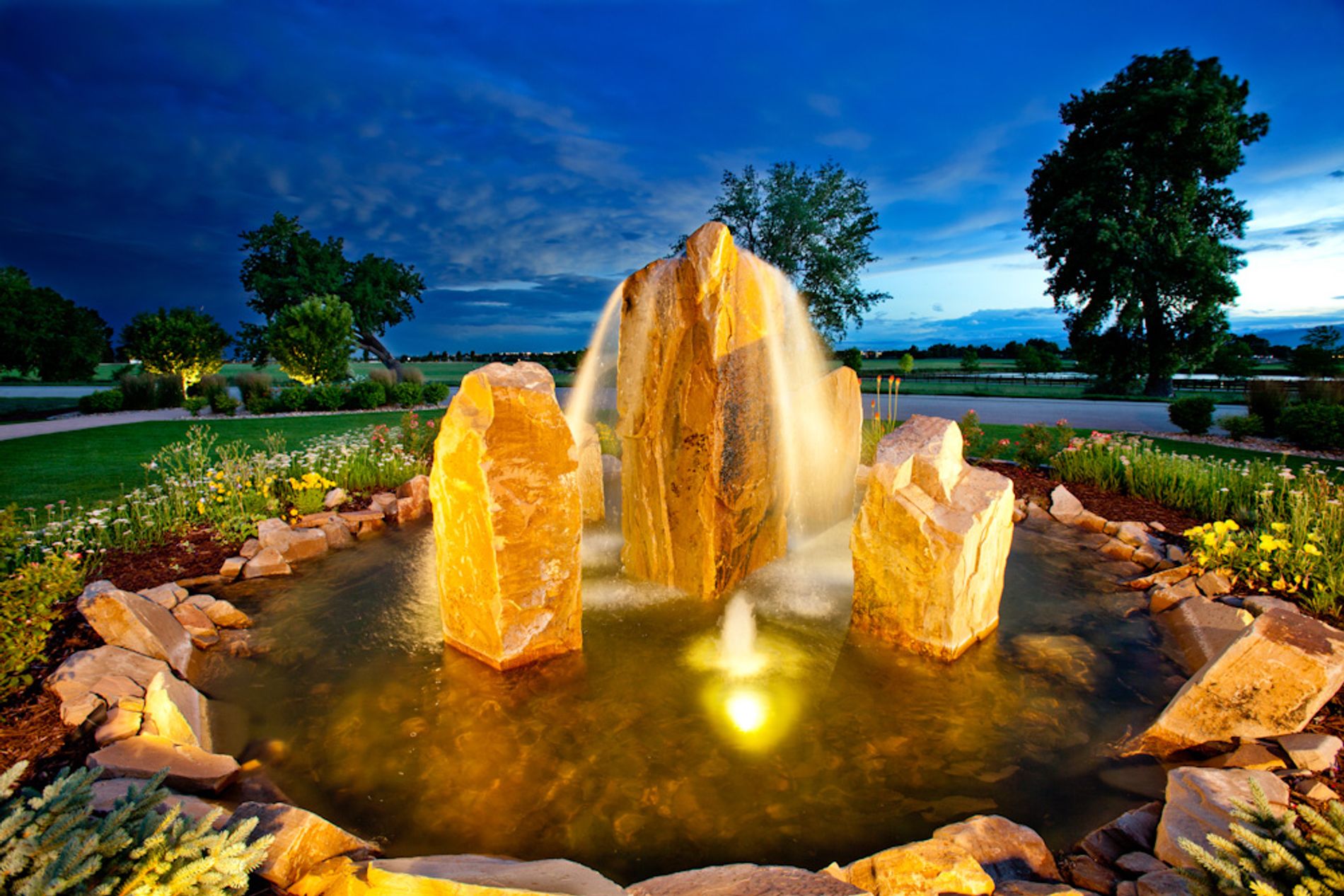 Cored Boulder Water Feature in Circle Driveway