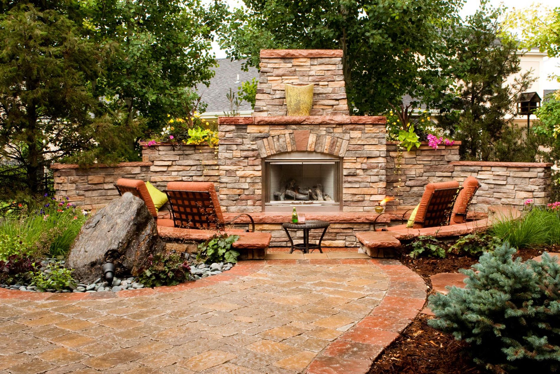 Masonry Outdoor Fireplace And Cored Boulder Water Feature