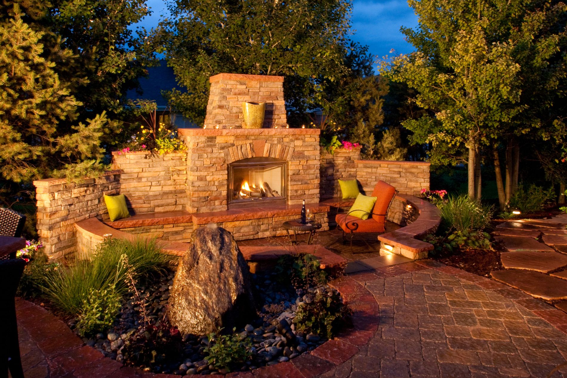 Outdoor Fireplace with stone veneer and Colorado red sandstone caps