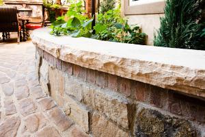 Masonry seat wall with paver patio