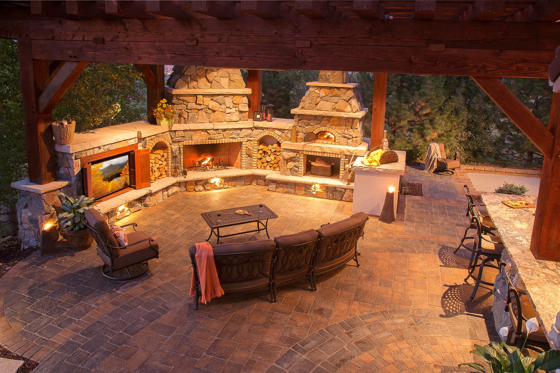 Outdoor fireplace, pizza oven, kitchen, and theater, with paver patios