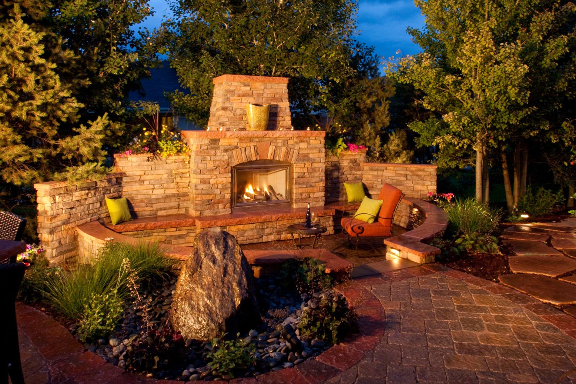 Outdoor Fireplace and Water Feature with Landscape Lights