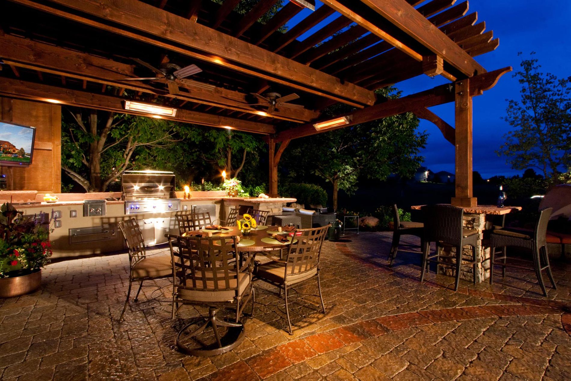 Outdoor Kitchen With Paver Patio and Shade Structure