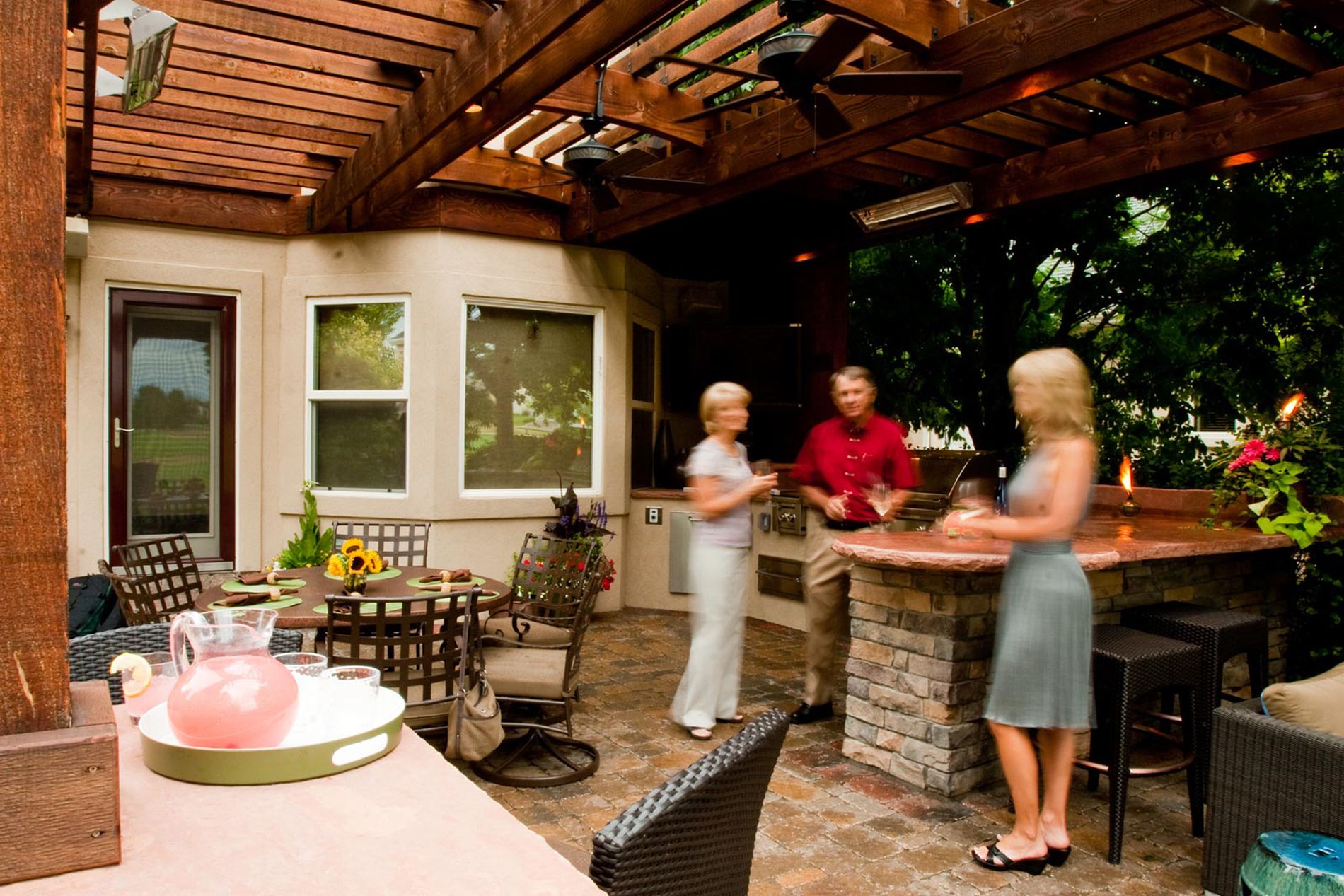 Outdoor Kitchen With Paver Patio and Shade Structure