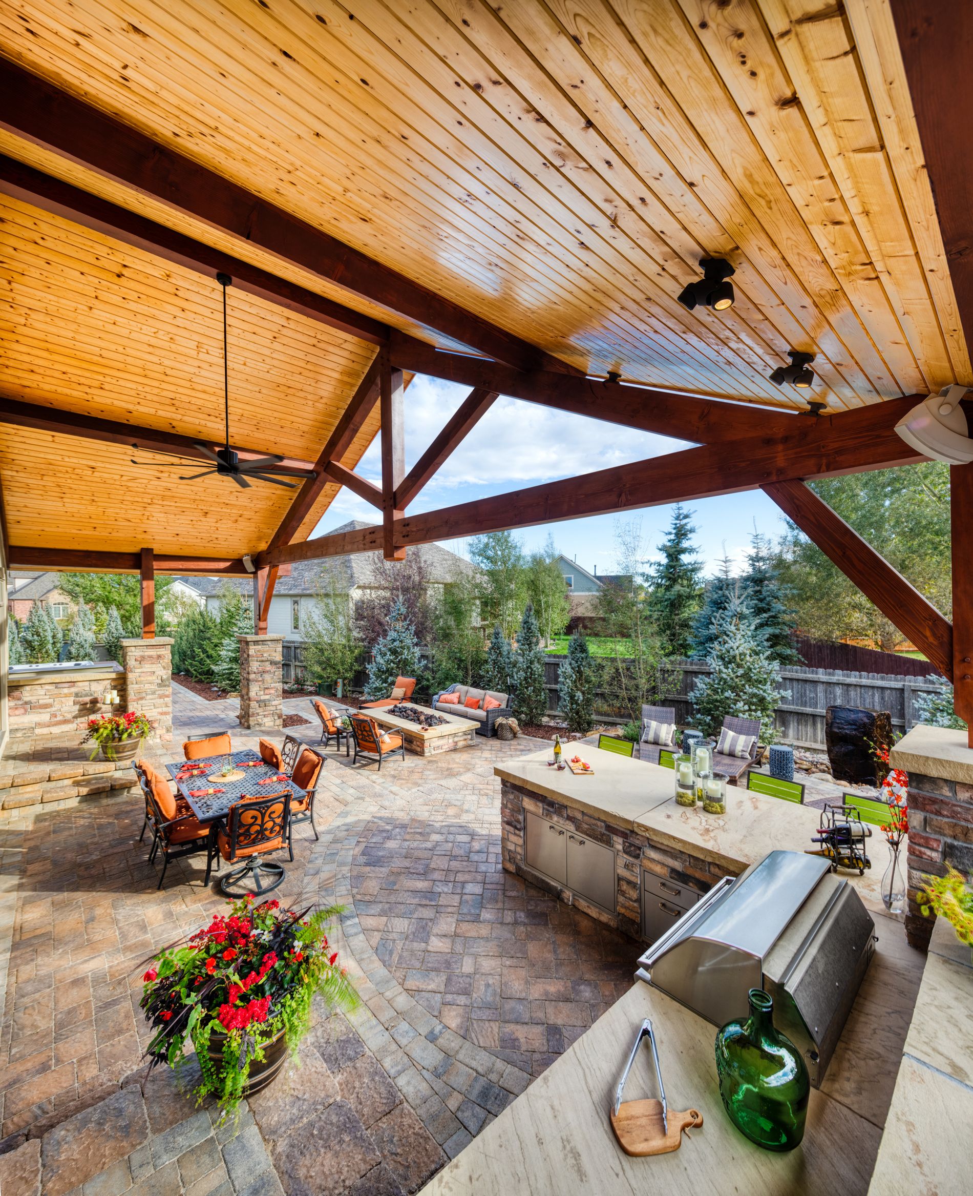 Timber frame gable roof covers this outdoor kitchen