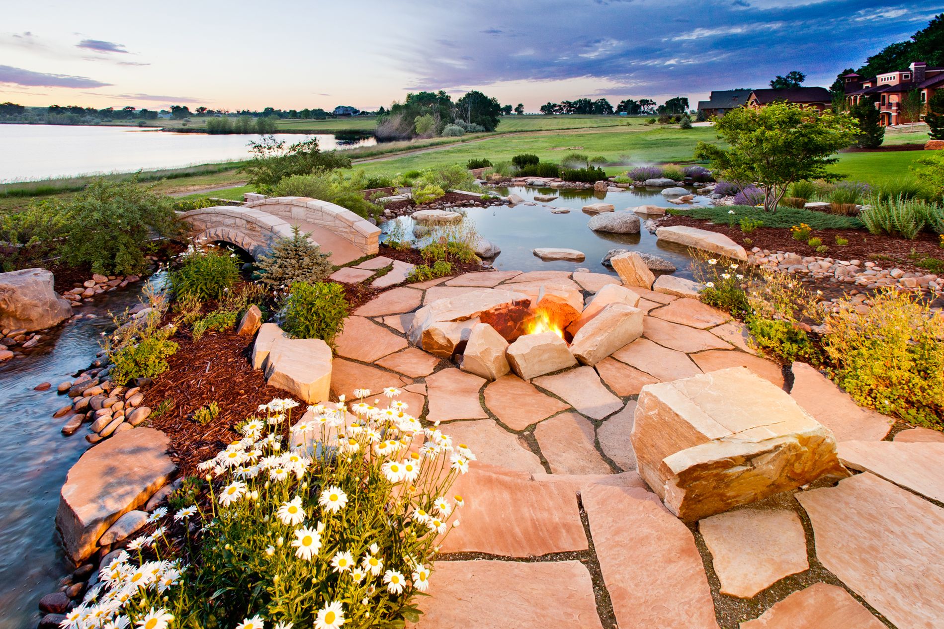 Boulder Fire Pit with Flagstone Patio and Water Features