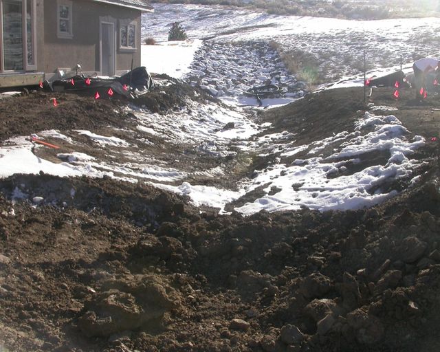 Cutting drainage swale to promote drainage