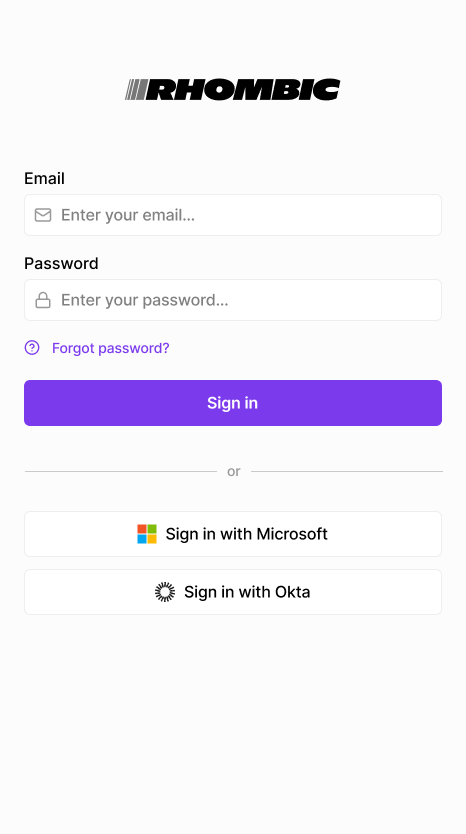 Login page with "Sign in with Microsoft" and "Sign in with Okta" options