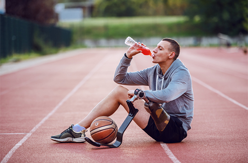 man drinking sports drink | how to prevent dehydration