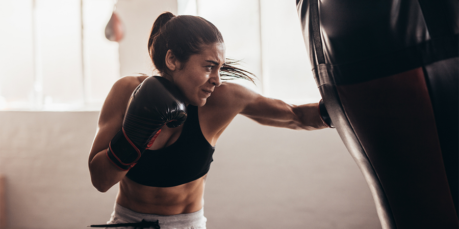 boxer hitting bag | vitamins for athletes