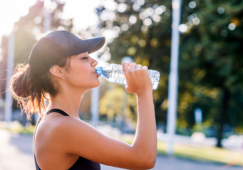 athlete drinking water | how to recover faster from workout