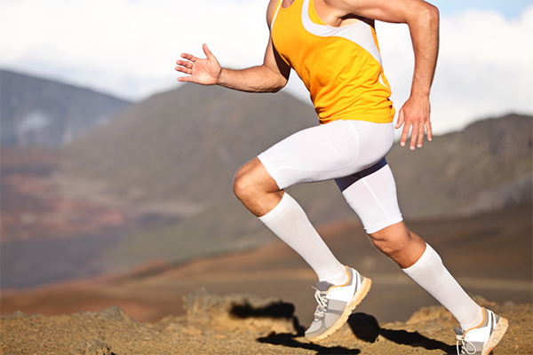man wearing compression tights while running | muscle recovery